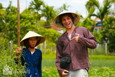 Happy farmer at Tra Que Village in Hoi an tour