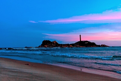 Lighthouse at Ke Ga Cape at sunset - Vietnam beach tour