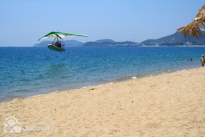 Flying kite in Nha Trang Beach - Vietnam beach vacation