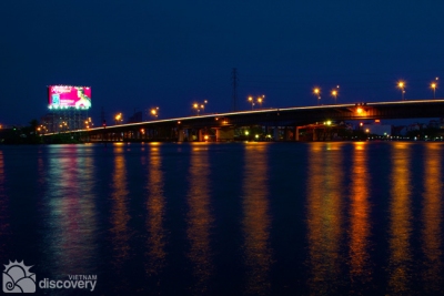 Saigon Bridge sparkling at night - Ho Chi Minh river tour by speedboat
