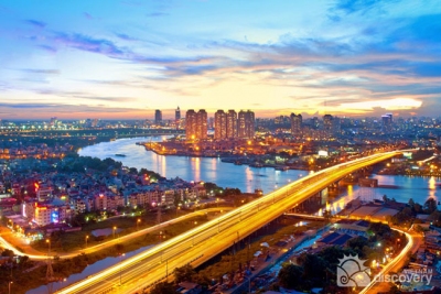 Saigon Bridge lightening up at night - Ho Chi Minh River tour on speedboat